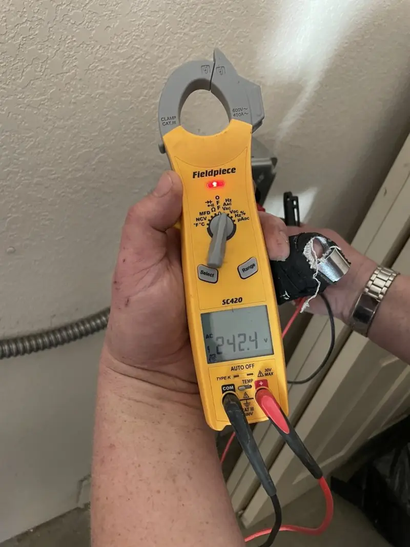 Voltage testing with clamp meter during Recessed Lighting Installation in Abington